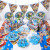 Toy story boy's birthday party with buzz lightyear-themed disposable paper plates, hats and tablecloths