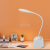 Manufacturers direct creative LED eye lamp charging modern simple bedroom bedside charging pen tube lamp