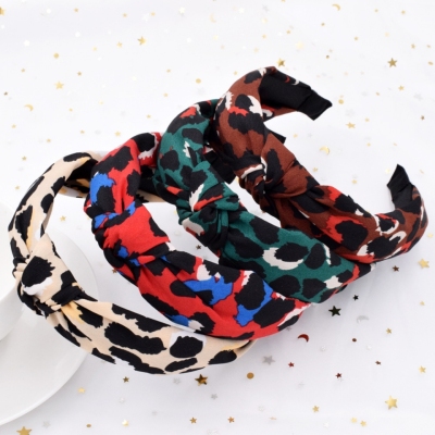 Amazon exaggerated leopard pattern hair band retro cross hair band creative cloth art knot headband female temperament hair accessories Europe and America