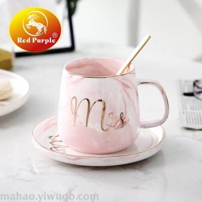 Ceramic coffee cup and saucer with spoon