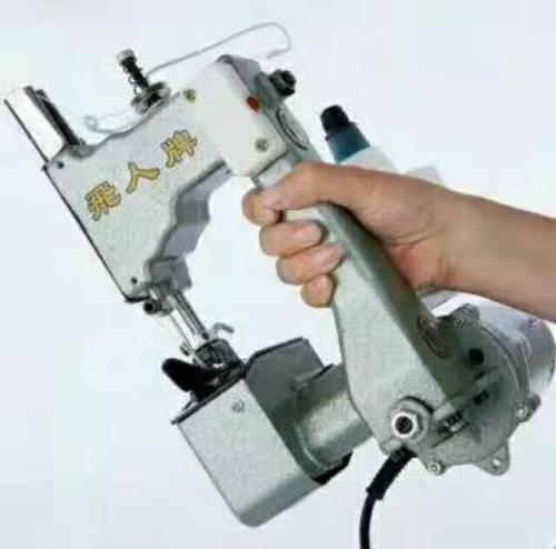 hand-held sewing machine