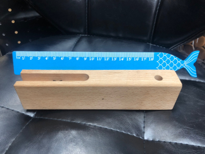 Green wooden ruler fish scale
