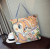 Springsummer new Korean canvas cartoon embroidered bag hand bill of lading shoulder shopping bag female baotou bag
