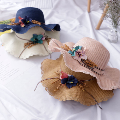 A new summer hat for girls with wavy brim and A straw hat