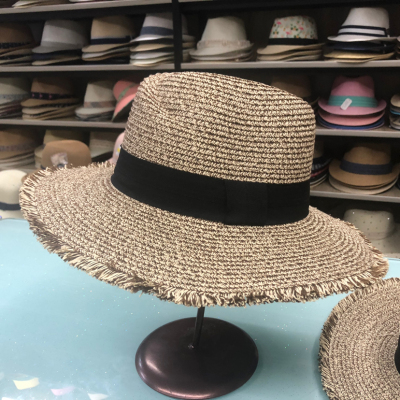 A straw hat a Panama hat with a brim