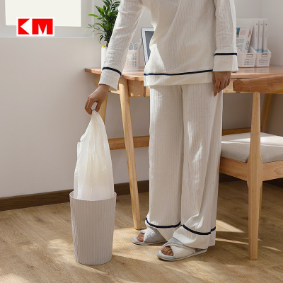 A simple wastebasket in the living room, bedroom and kitchen
