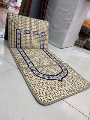 A new 3D printed Muslim folding prayer rug with A backrest and A Muslim rug from the Arab world