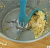 Rotating scraper food processing tool blender feeding tool can wall scraper