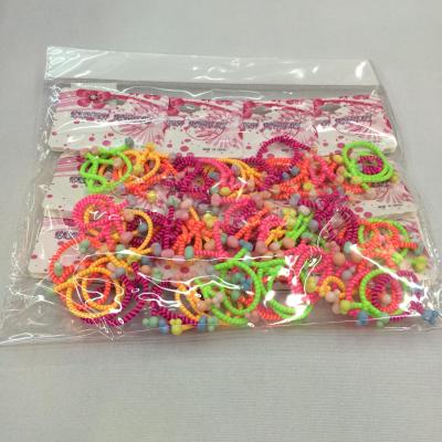 6 fine knotted rubber band beads stuck