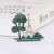 Innovative Green Pine has Eiffel Tower, brooch sweater and accessories pin