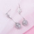 Manhuini Sterling Silver Needle Hollow Flower Cat Eye Earrings Fashion Elegant Female Earrings Temperament Wild Japanese and Korean Earrings