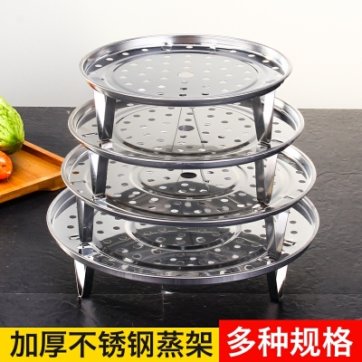 A stainless steel rack in the floor; A small mini steamer tray; A Steamer rack with water; A steamer rack 20