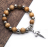 Pine beads with cross beads hanging a Virgin bracelet