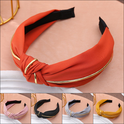 The factory direct sale new top grade stripe hits color gold edge hair hoop to tie knot to twist knot wide edge head hoop Korean edition hair ornaments