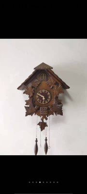 Wood wall clock with cuckoo calls