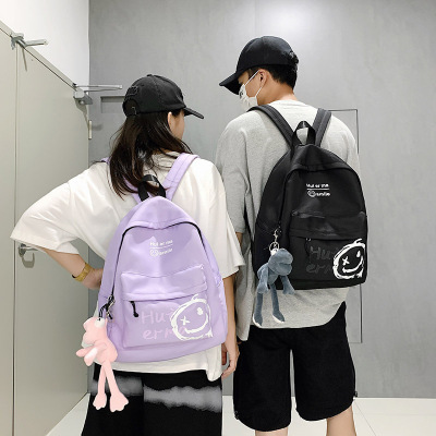 2021 New Smiley Face Schoolbag Wholesale Trendy Korean Style Junior and Middle School Students Simple Canvas Backpack Men and Women's Pendants Backpack