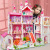 Creative girl assembling big villa children's play house simulation toy DIY doll house