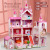 Creative girl assembling big villa children's play house simulation toy DIY doll house