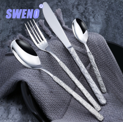 A Western Food/Steak Knife and Fork Mirror Light 304 Stainless Steel Knife, Fork and Spoon Four-Piece Set Creative Relief Stone Pattern Sanding Tableware