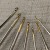 Factory Direct Sales Knitting Tools New Small Curved Handle Printing Fine Gold Head Iron Crochet Set of 8 Pieces
