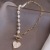 Korean New Patchwork Necklace Women's Niche Design Love Pendant Imitation Pearl Online Influencer Clavicle Chain Wholesale