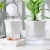 Automatic water feeding ceramic flower pot lazy flower pot minimalist creative home desktop pot ceramic basin wholesale